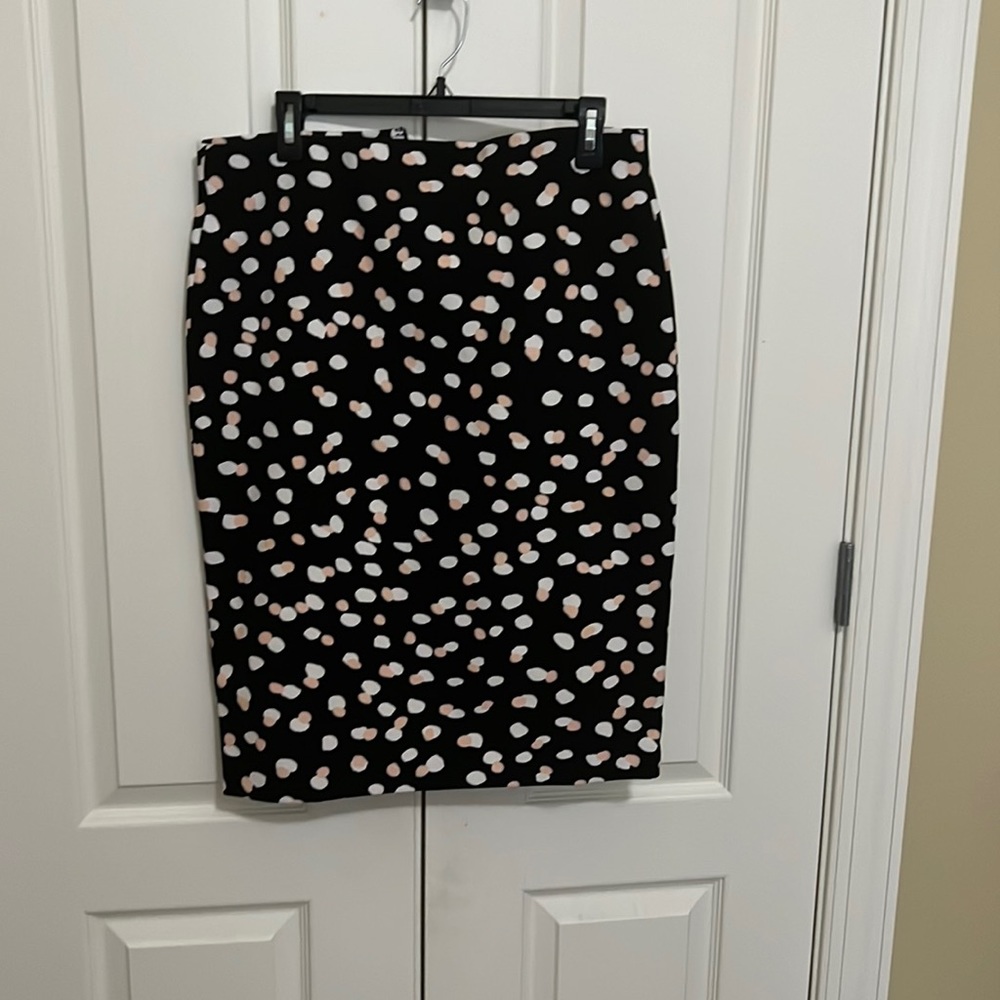 A brand new cute pencil skirt with a back split.